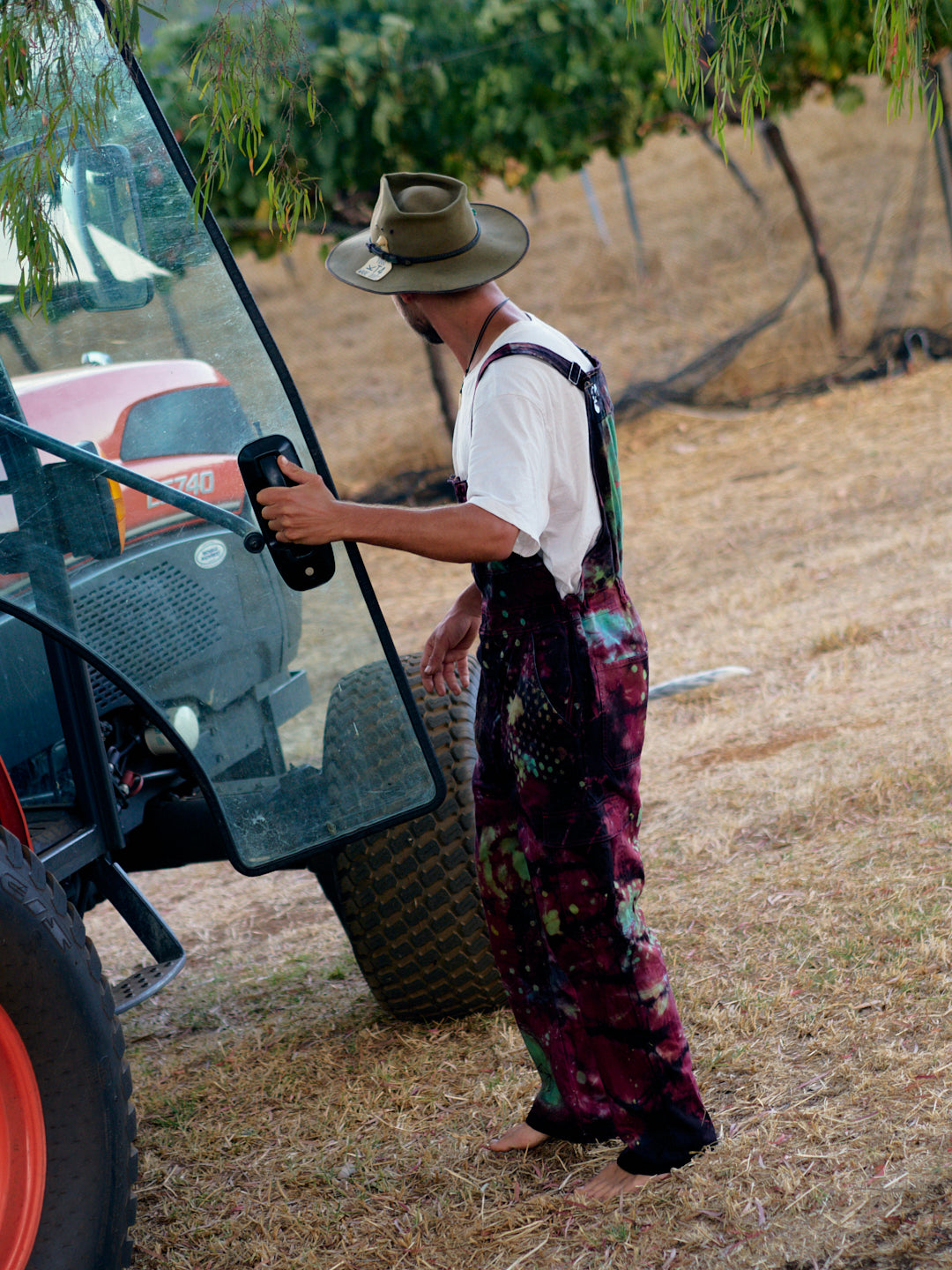 multicoloured  red with green spots  overalls  worn with white tshirt